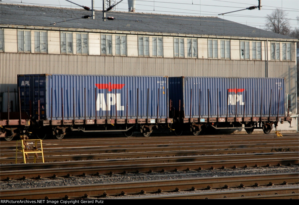 Two APL 20 containers on 2-axel flatcars